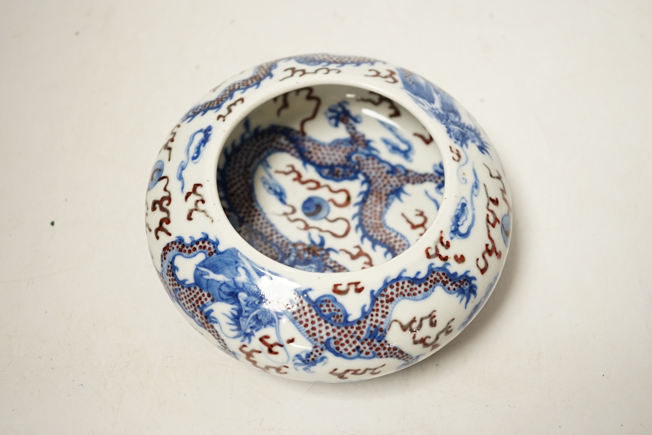 A Chinese underglaze blue and copper red ‘Dragon’ brushwasher, Guangxu period, 15cm diameter